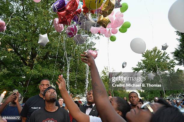 Mourners release balloons during a candlelight vigil held in honor of Jamyla Bolden on August 20, 2015 in Ferguson, Missouri. Jamyla Bolden was...