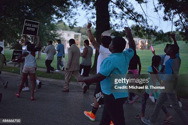 Children march down Canfield Drive during a candlelight vigil held in honor of Jamyla Bolden on August 20, 2015 in Ferguson, Missouri. Jamyla Bolden...