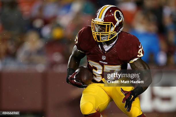 Mack Brown of the Washington Redskins carries the ball during a preseason game against the Detroit Lions at FedEx Field on August 20, 2015 in...