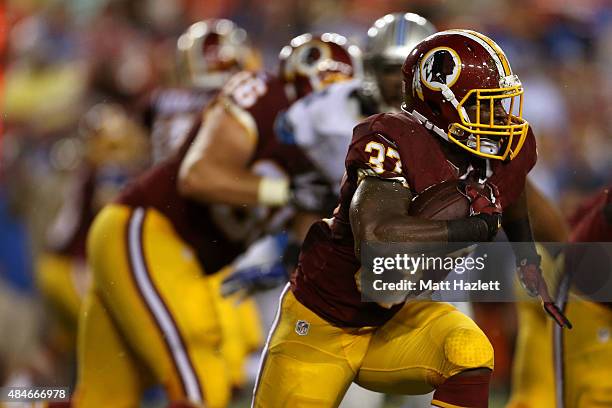 Mack Brown of the Washington Redskins carries the ball during a preseason game against the Detroit Lions at FedEx Field on August 20, 2015 in...