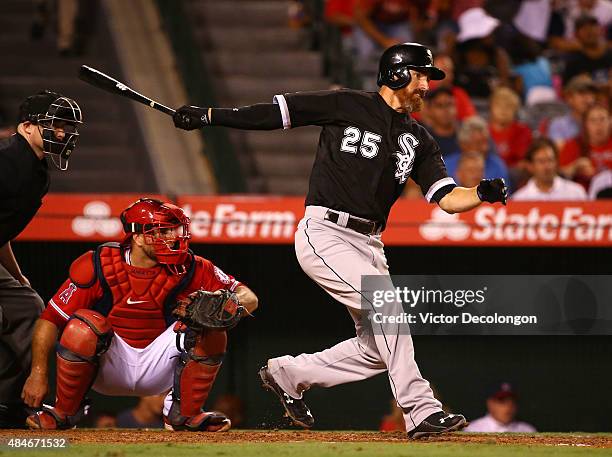 Adam LaRoche of the Chicago White Sox hits a single to right field in the fifth inning during the MLB game against the Los Angeles Angels of Anaheim...