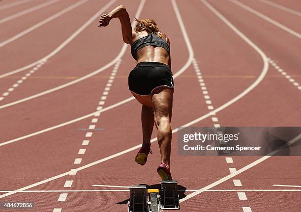 An athlete practices a sprint start ahead of the 15th IAAF World Athletics Championships Beijing 2015 at the Beijing National Stadium on August 21,...