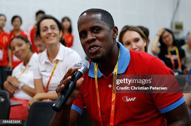 Long jumper Dwight Phillips asks a question during a news conference for the United States ahead of the 15th IAAF World Athletics Championships...