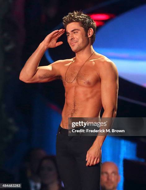 Actor Zac Efron accepts the Best Shirtless Performance award for 'That Awkward Moment' onstage at the 2014 MTV Movie Awards at Nokia Theatre L.A....