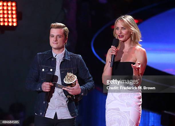 Actor Josh Hutcherson accepts the Best Male Performance award for 'The Hunger Games: Catching Fire' from actress Cameron Diaz onstage at the 2014 MTV...