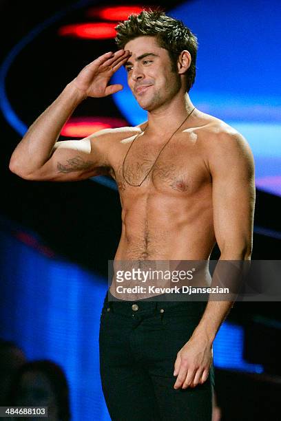 Actor Zac Efron accepts the Best Shirtless Performance award for 'That Awkward Moment' onstage at the 2014 MTV Movie Awards at Nokia Theatre L.A....