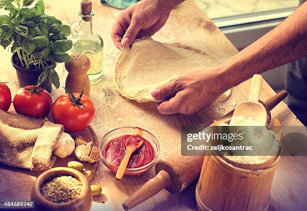 preparing ingredients of homemade pizza - making pizza stock pictures, royalty-free photos & images