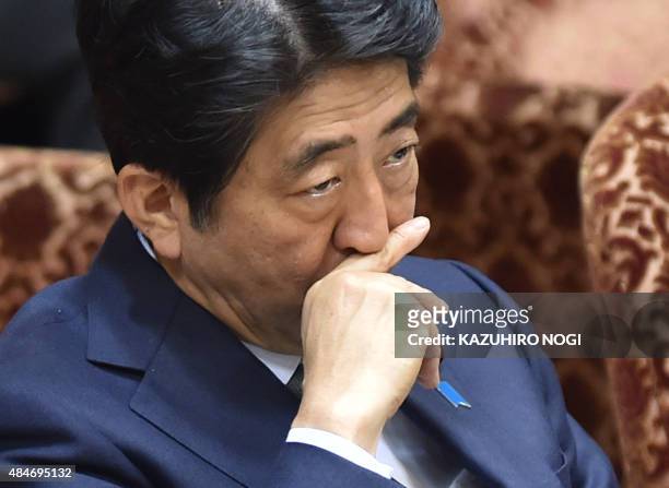 Japan's Prime Minister Shinzo Abe attends a special committee session in the upper house of parliament in Tokyo on August 21, 2015. The upper house...
