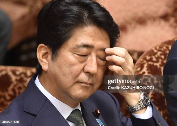 Japan's Prime Minister Shinzo Abe attends a special committee session in the upper house of parliament in Tokyo on August 21, 2015. The upper house...