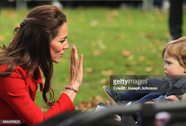 Catherine, Duchess of Cambridge greets young toddlers during the countdown to the 2015 ICC Cricket World Cup at Latimer Square on April 14, 2014 in...