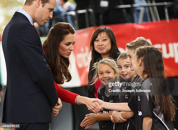 Catherine, Duchess of Cambridge shakes young Henry Allott's hand during the countdown to the 2015 ICC Cricket World Cup at Latimer Square on April...