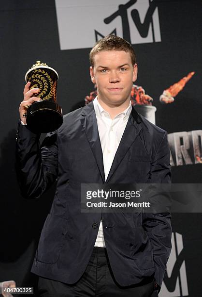 Actor Will Poulter poses with the Best Kiss award for 'We're the Millers' in the press room during the 2014 MTV Movie Awards at Nokia Theatre L.A....
