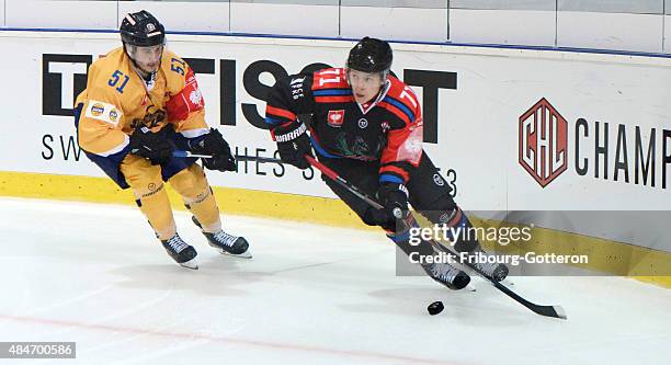 Jesse Virtanen of Lukko Rauma chases Killian Mottet of Fribourg-Gotteron during the Champions Hockey League group stage game between...