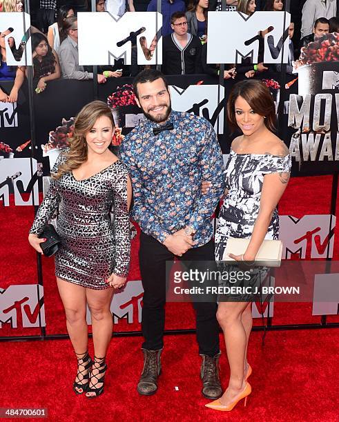Television personalities Camila Nakagawa , Frank Sweeney and Aneesa Ferreira arrive on the red carpet for the 2014 MTV Movie Awards at the Nokia...
