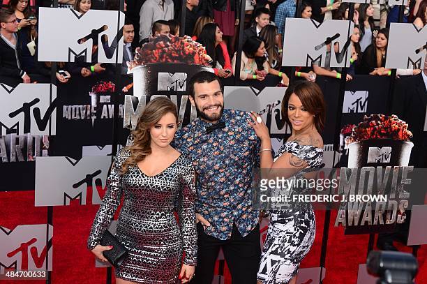 Television personalities Camila Nakagawa , Frank Sweeney and Aneesa Ferreira arrive on the red carpet for the 2014 MTV Movie Awards at the Nokia...