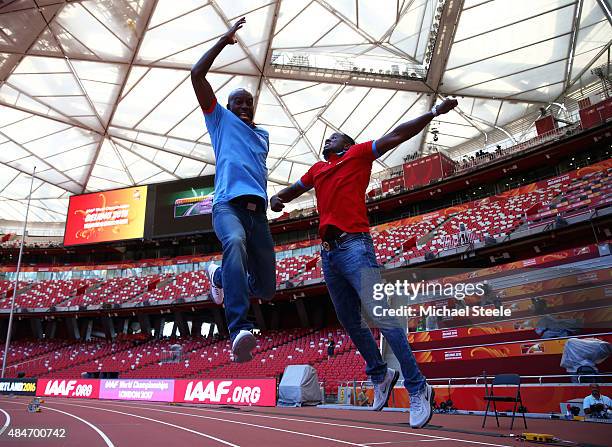Former United States athletes Allen Johnson and Dwight Phillips jump in the air during a photo opportunity ahead of the 15th IAAF World Athletics...