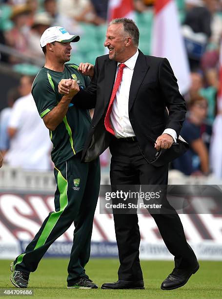 Ian Botham shares a joke with Australia coach Greg Blewett before day two of the 5th Investec Ashes Test match between England and Australia at The...