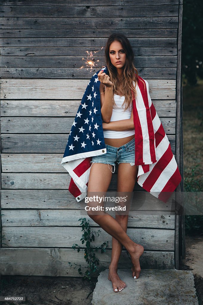 Young woman with American flag.