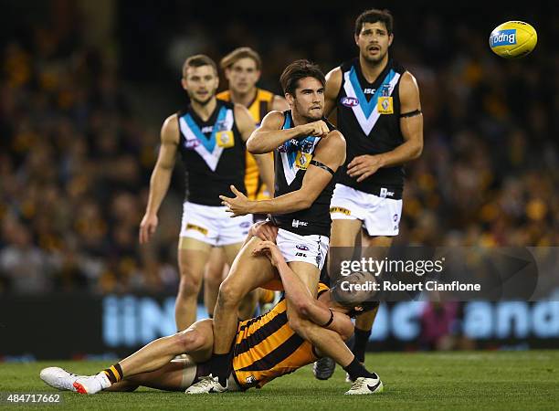 Chad Wingard of Port Adelaide is challenged by Jordan Lewis of the Hawks during the round 21 AFL match between the Hawthorn Hawks and Port Adelaide...