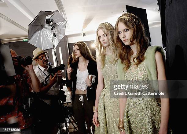 Models are photographed backstage before the Elie Saab show as part of Paris Fashion Week Haute Couture Fall/Winter 2015/2016 on July 8, 2015 in...