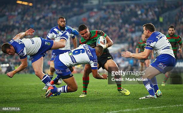 Dylan Walker of the Rabbitohs tries to break the bulldogs defence during the round 24 NRL match between the South Sydney Rabbitohs and the Canterbury...