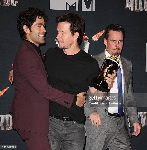 Actors Adrian Grenier, Mark Wahlberg and Kevin Dillon pose in the press room at the 2014 MTV Movie Awards at Nokia Theatre L.A. Live on April 13,...