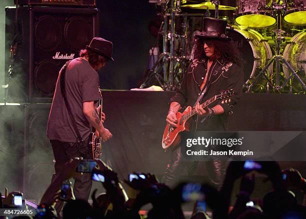 Musician Slash performs onstage with Phil "Wizzö" Campbell of Motorhead during day 3 of the 2014 Coachella Valley Music & Arts Festival at the Empire...