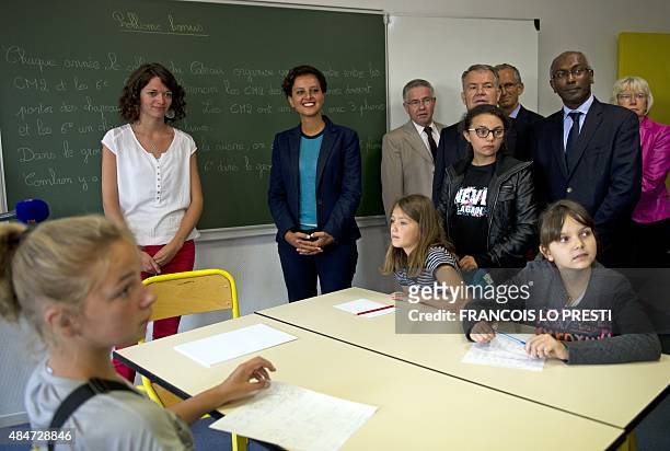 French Minister of Education Najat Vallaud-Belkacem meets with students at the Jean Rostand high school in Le Cateau Cambresis on August 21 to...