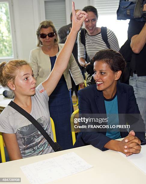 French Minister of Education Najat Vallaud-Belkacem meets with students at the Jean Rostand high school in Le Cateau Cambresis on August 21 to...
