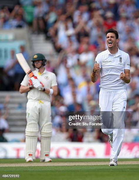 England bowler Steven Finn celebrates after dismissing Australia batsman Mitchell Marsh to claim his 100th test wicket during day two of the 5th...