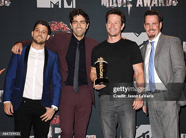 Actors Jerry Ferrara, Adrian Grenier, Mark Wahlberg and Kevin Dillon pose in the press room at the 2014 MTV Movie Awards at Nokia Theatre L.A. Live...