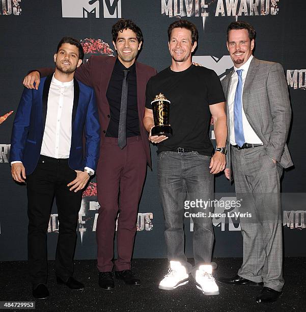 Actors Jerry Ferrara, Adrian Grenier, Mark Wahlberg and Kevin Dillon pose in the press room at the 2014 MTV Movie Awards at Nokia Theatre L.A. Live...