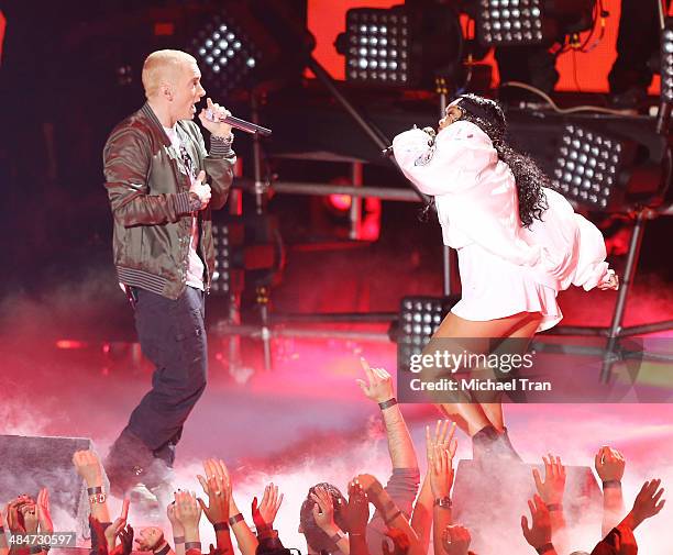 Eminem and Rihanna perform onstage during the 2014 MTV Movie Awards held at Nokia Theatre L.A. Live on April 13, 2014 in Los Angeles, California.