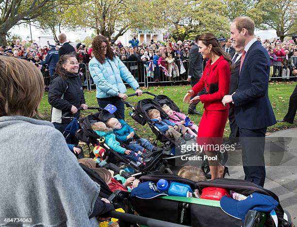 Catherine, Duchess of Cambridge and Prince William Duke of Cambridge meets sets of twins as they greet the public in Latimer Square Gardens on April...