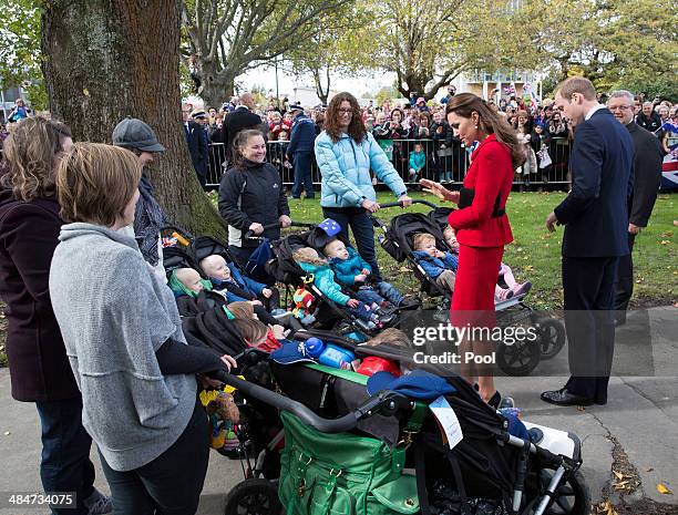 Catherine, Duchess of Cambridge and Prince William Duke of Cambridge meets sets of twins as they greet the public in Latimer Square Gardens on April...