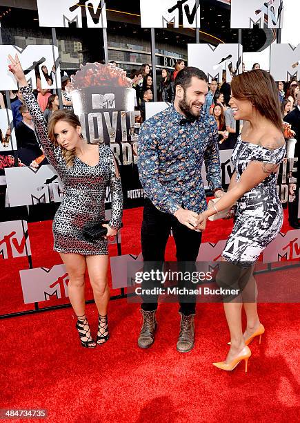 Personalities Camila Nakagawa, Frank Sweeney and Aneesa Ferreira attend the 2014 MTV Movie Awards at Nokia Theatre L.A. Live on April 13, 2014 in Los...