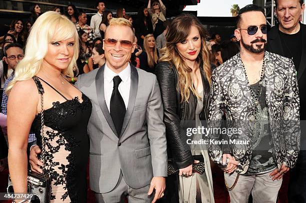 Rochelle Deanna Karidis, musicians A.J. McLean and Brian Littrell of the Backstreet Boys and Leighanne Littrell attend the 2014 MTV Movie Awards at...