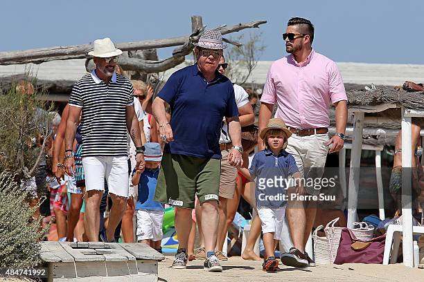 Elton John and David Furnish and their their son Zachary Jackson Levon Furnish-John arrive at 'club55' for lunch on August 21, 2015 in Saint-Tropez,...