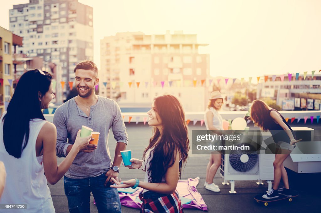 Friends on a rooftop party
