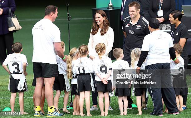 Catherine, Duchess of Cambridge shares a joke with junior rippa rugby players and All Blacks captain Richie McCaw at Forsyth Barr Stadium, Dunedin on...