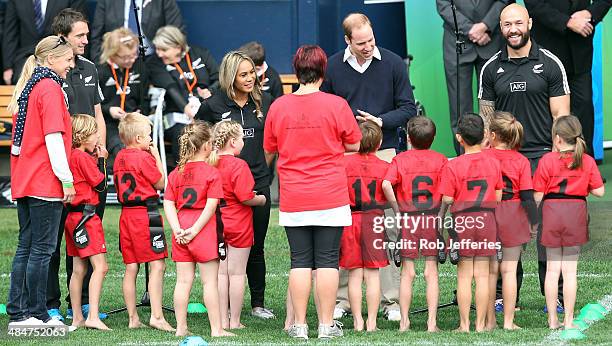 Prince William, Duke of Cambridge talks with the junior rippa rugby players while Ben Smith of the All Blacks and D J Forbes, All Blacks Sevens...