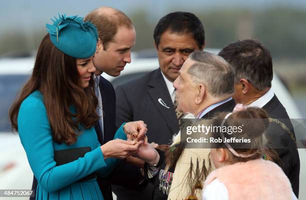 Prince William, Duke of Cambridge and Catherine, Duchess of Cambridge receives a traditional Maori Greenstone gift at the official greeting at...