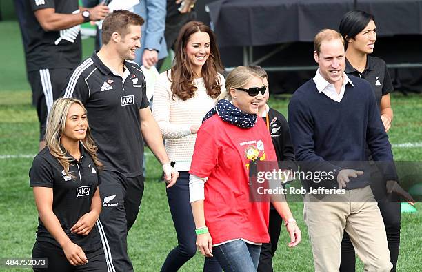 Prince William, Duke of Cambridge talks to a parent of one of the rippa rugby teams while Catherine, Duchess of Cambridge shares a joke with All...