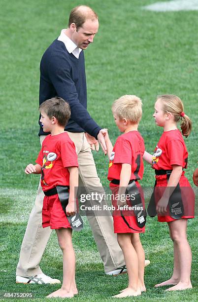 Prince William, Duke of Cambridge congratulates the junior rippa rugby players at Forsyth Barr Stadium, Dunedin on April 13, 2014 in Dunedin, New...