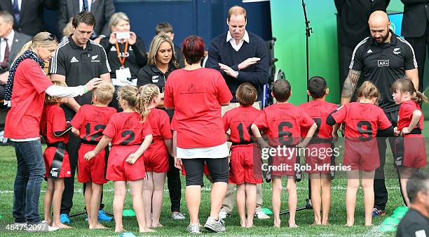 Prince William, Duke of Cambridge talks with the junior rippa rugby players while Ben Smith of the All Blacks and D J Forbes, All Blacks Sevens...
