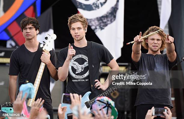 Calum Hood, Luke Hemmings, and Ashton Irwin of 5 Seconds Of Summer Perform on ABC's "Good Morning America" at Rumsey Playfield, Central Park on...