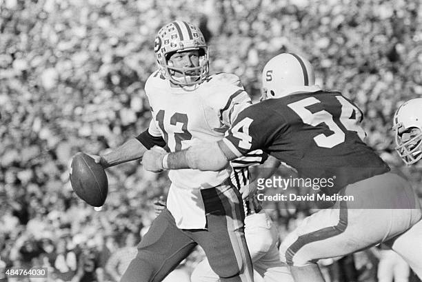 Joe Roth of the California Golden Bears attempts a pass during the 1975 Big Game against Stanford University played on November 22, 1975 at Stanford...