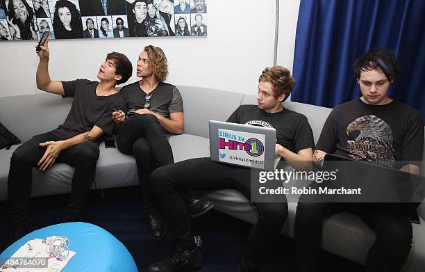 Calum Hood, Ashton Irwin, Luke Hemmings and Michael Clifford of 5 Seconds of Summer visit at SiriusXM Studios on August 21, 2015 in New York City.