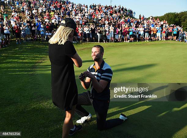 Andreas Harto of Denmark proposes to his girfriend Louise De Fries on the 16th hole during the second round of the Made in Denmark at Himmerland Golf...