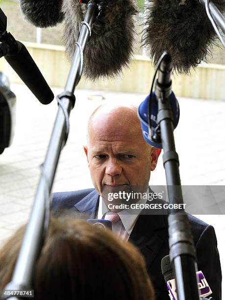 Secretary of State for Foreign and Commonwealth Affairs William Hague talks to the prior a Foreign Affairs Council on April 14,2014 at the EU...